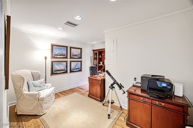 home office featuring light wood-style flooring, recessed lighting, visible vents, baseboards, and crown molding