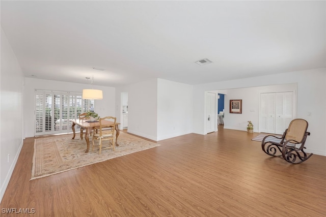 dining space featuring light wood-type flooring