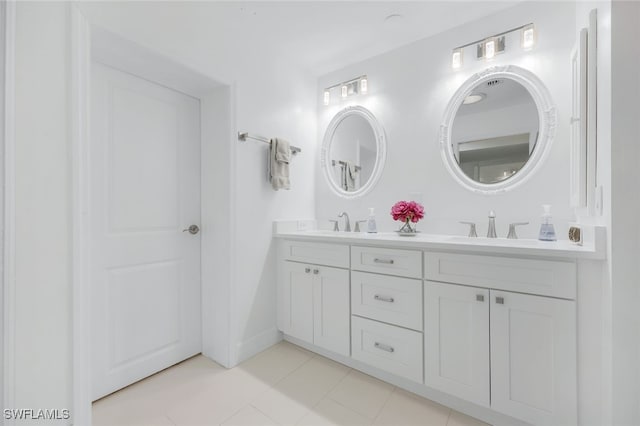 bathroom featuring tile patterned flooring and vanity