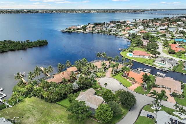 birds eye view of property featuring a water view