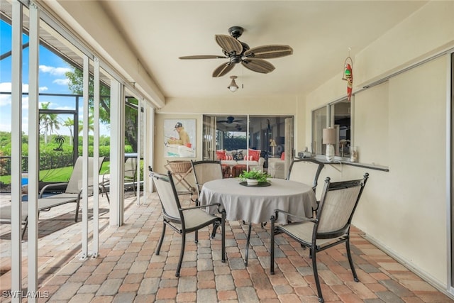 sunroom / solarium with ceiling fan