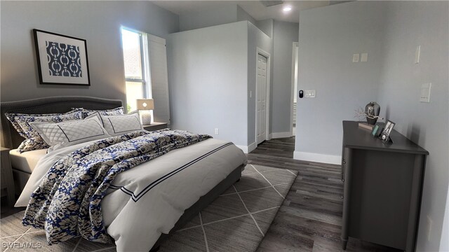 bedroom featuring dark wood-type flooring