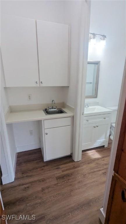 6733 Bent Grass Dr, Naples, FL 34113 - interior space with a sink and wood finished floors