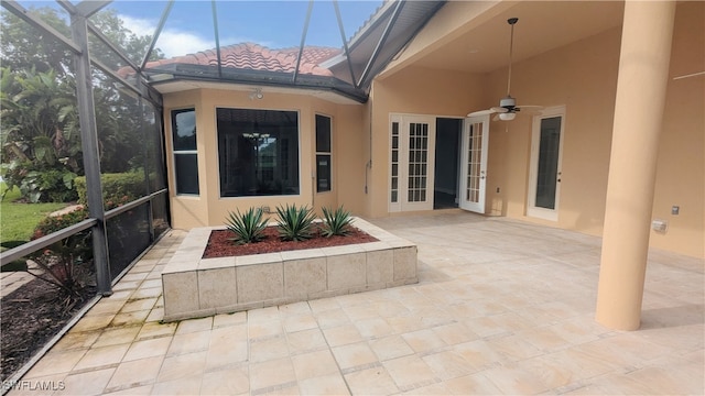 exterior space featuring lofted ceiling, a healthy amount of sunlight, and ceiling fan