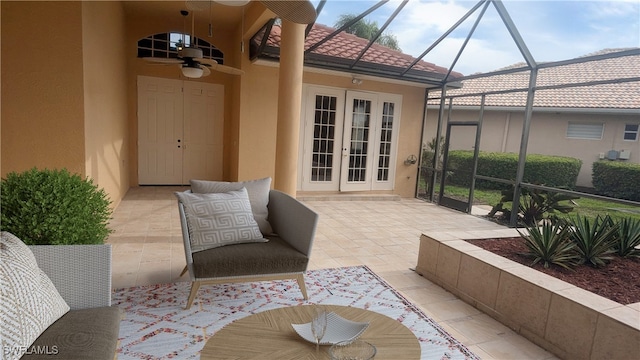 view of patio with french doors, glass enclosure, and ceiling fan