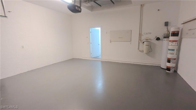 6733 Bent Grass Dr, Naples, FL 34113 - garage featuring gas water heater and a garage door opener
