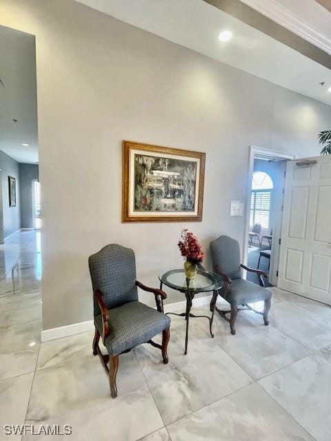 sitting room with marble finish floor, recessed lighting, and baseboards