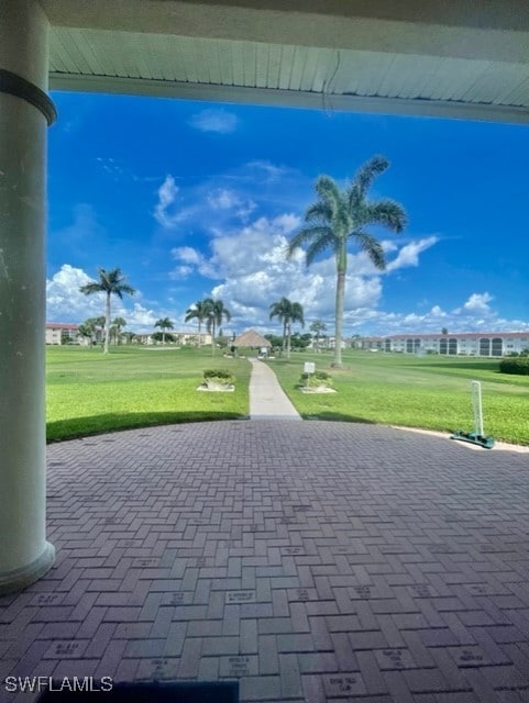 view of property's community with a lawn