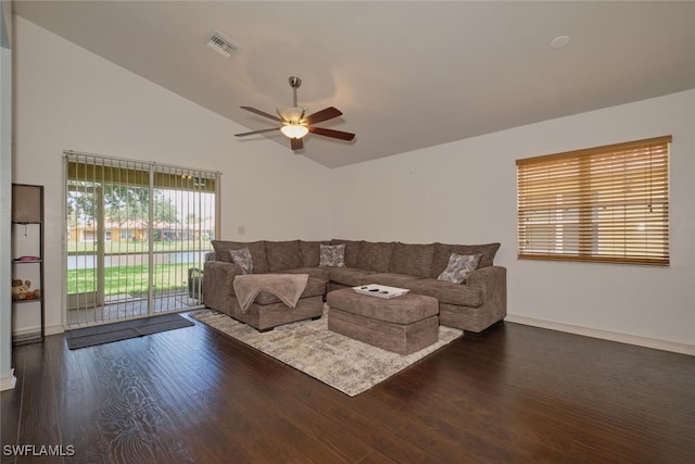 living room with lofted ceiling, ceiling fan, and dark hardwood / wood-style flooring