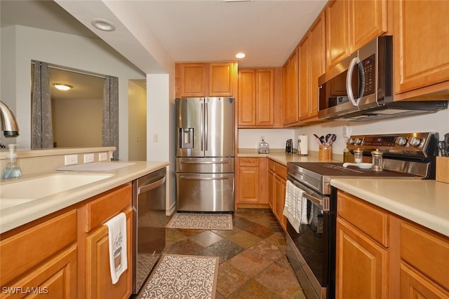 kitchen with appliances with stainless steel finishes and sink