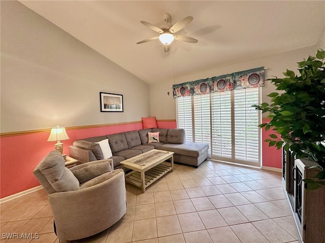 living room featuring ceiling fan, vaulted ceiling, and light tile patterned flooring