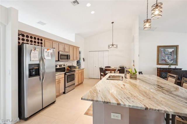 kitchen with pendant lighting, vaulted ceiling, stainless steel appliances, and sink