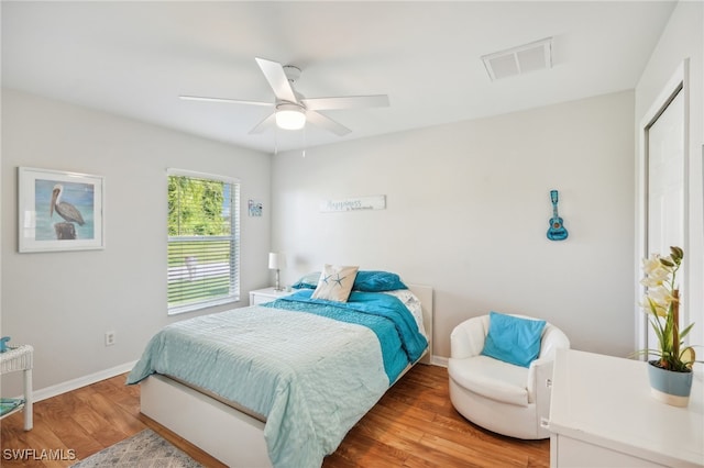 bedroom featuring a closet, ceiling fan, and hardwood / wood-style flooring