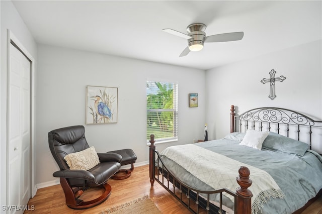 bedroom featuring wood-type flooring, a closet, and ceiling fan