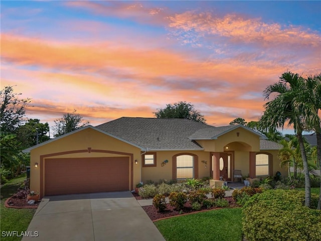 view of front of property with a garage