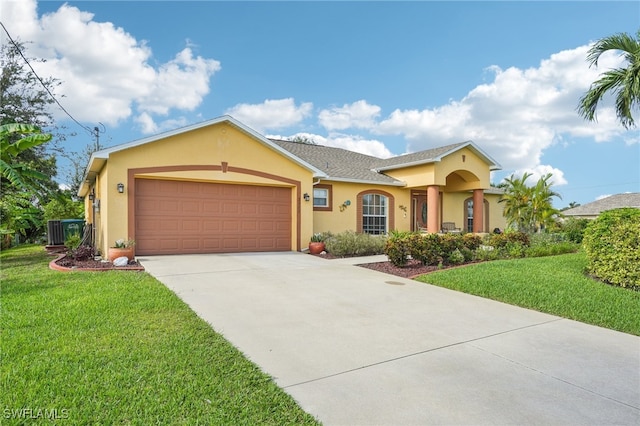 single story home with a front lawn, central AC unit, and a garage