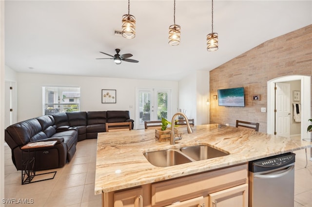 kitchen with pendant lighting, lofted ceiling, ceiling fan, and sink