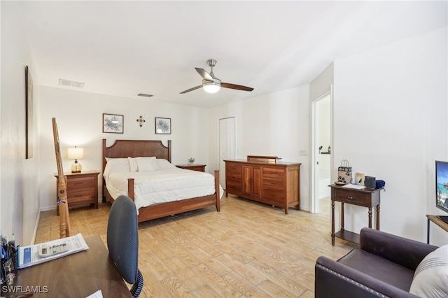 bedroom featuring a closet, light wood-type flooring, and ceiling fan