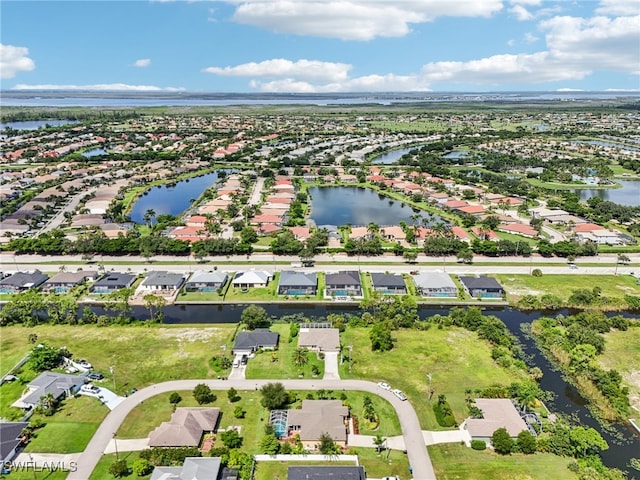 bird's eye view with a water view