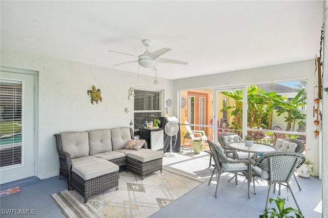 sunroom / solarium with ceiling fan