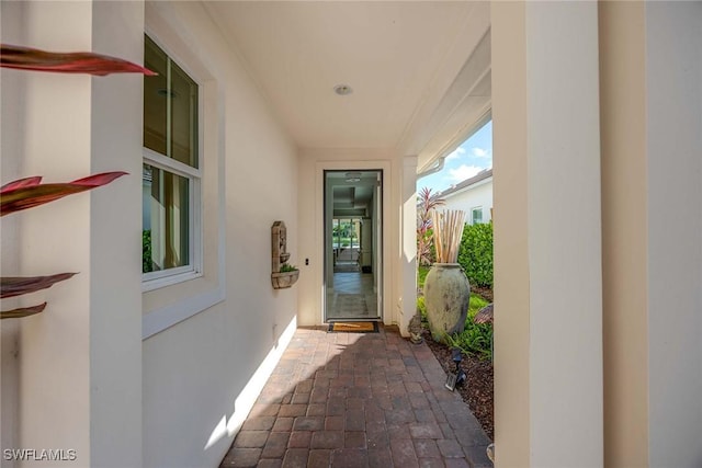 14151 Nautica Ct, Naples, FL 34114 - property entrance with a patio and stucco siding