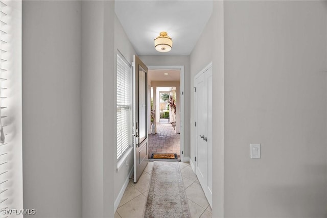 14151 Nautica Ct, Naples, FL 34114 - corridor with light tile patterned flooring and baseboards