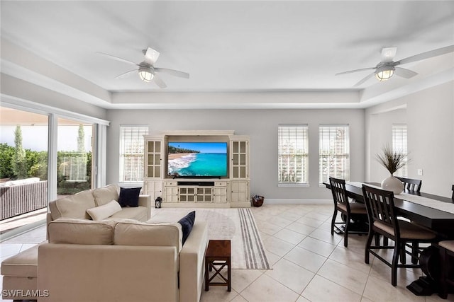 14151 Nautica Ct, Naples, FL 34114 - living area featuring a ceiling fan, baseboards, and light tile patterned floors