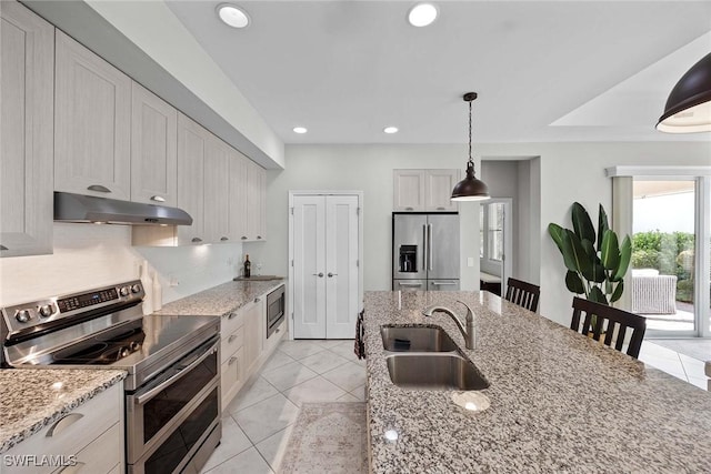 14151 Nautica Ct, Naples, FL 34114 - kitchen featuring appliances with stainless steel finishes, decorative light fixtures, under cabinet range hood, a sink, and recessed lighting