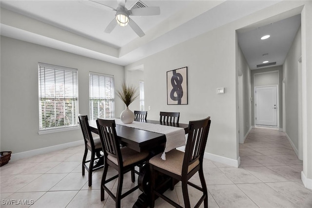 14151 Nautica Ct, Naples, FL 34114 - dining space featuring a tray ceiling, recessed lighting, light tile patterned flooring, ceiling fan, and baseboards