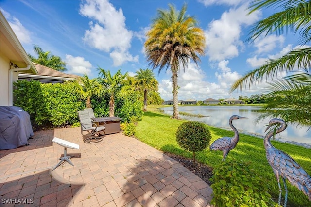 14151 Nautica Ct, Naples, FL 34114 - view of patio / terrace featuring a water view and area for grilling