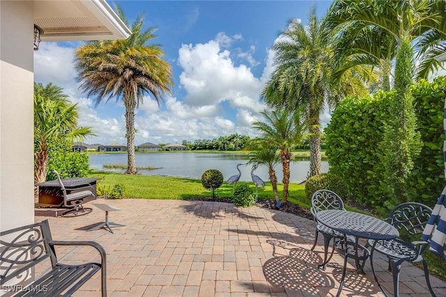 14151 Nautica Ct, Naples, FL 34114 - view of patio / terrace with a water view