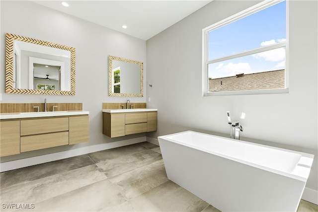 bathroom featuring a bath and vanity