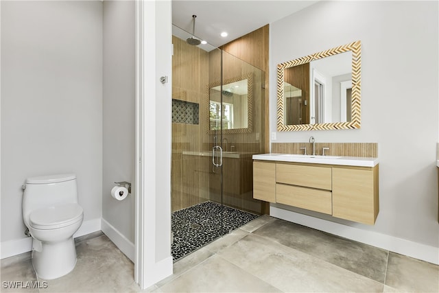 bathroom with vanity, toilet, and walk in shower