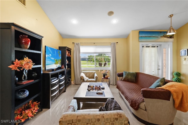 living room with lofted ceiling and french doors