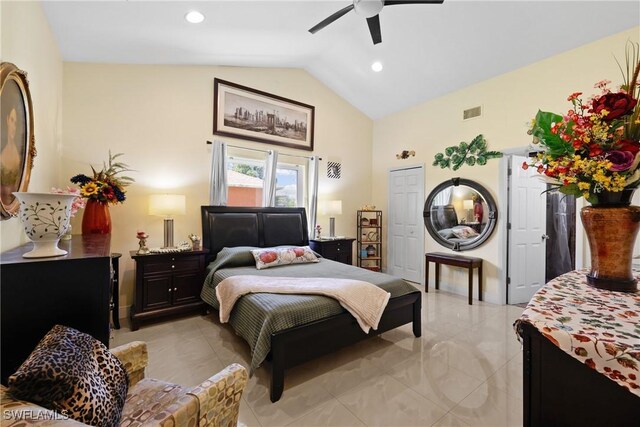 bedroom featuring a closet, ceiling fan, and lofted ceiling