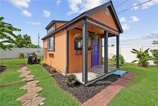 view of outbuilding with a lawn