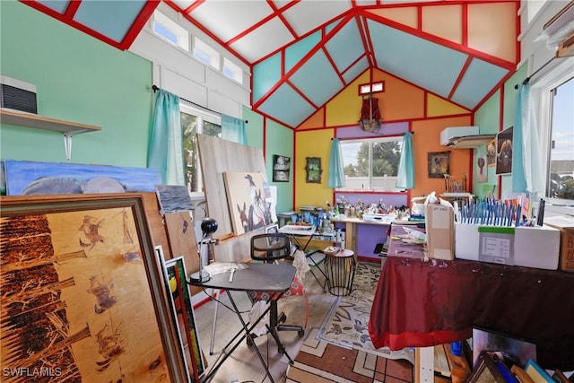 miscellaneous room with a wall mounted air conditioner and lofted ceiling