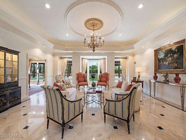 living room featuring crown molding, a raised ceiling, and a chandelier