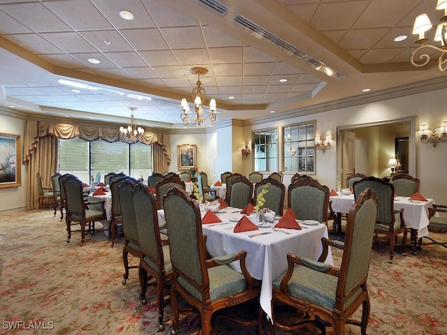 carpeted dining space featuring ornamental molding and a notable chandelier