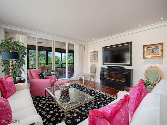 living room with ornamental molding and hardwood / wood-style flooring