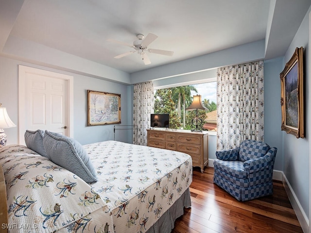 bedroom with hardwood / wood-style flooring and ceiling fan