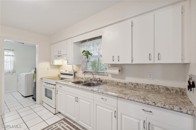 kitchen featuring sink, light tile patterned floors, electric range, separate washer and dryer, and white cabinetry