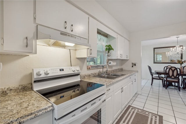 kitchen featuring white cabinets, a notable chandelier, electric stove, and sink