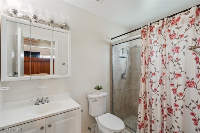 bathroom with toilet, vanity, and a shower with shower curtain