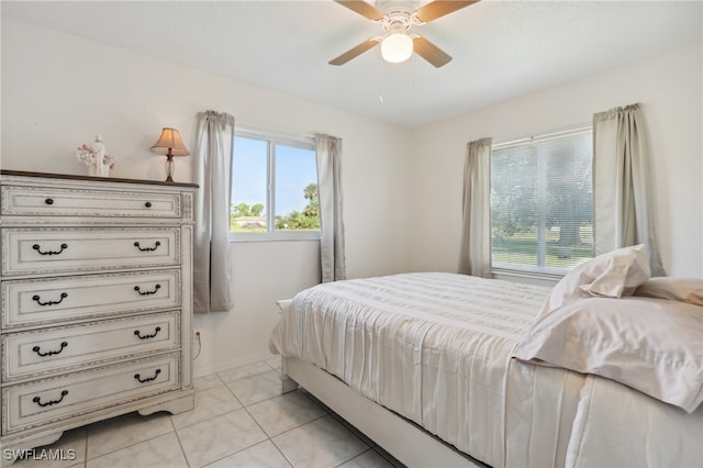 bedroom with light tile patterned floors and ceiling fan