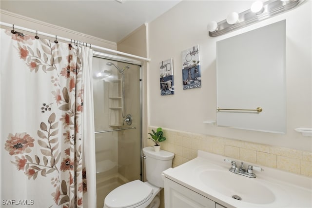 bathroom featuring a shower, vanity, and toilet