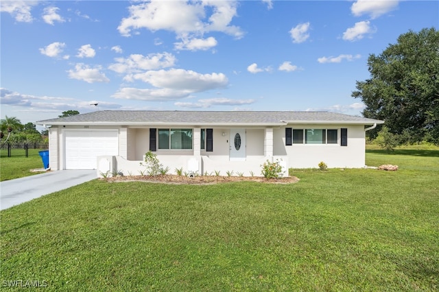 single story home with a garage and a front lawn