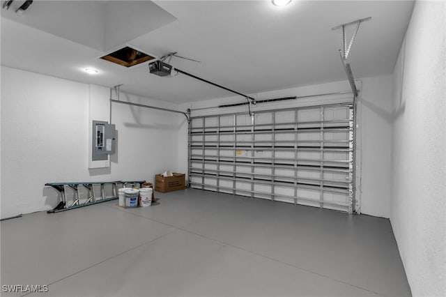 garage featuring a garage door opener and electric panel