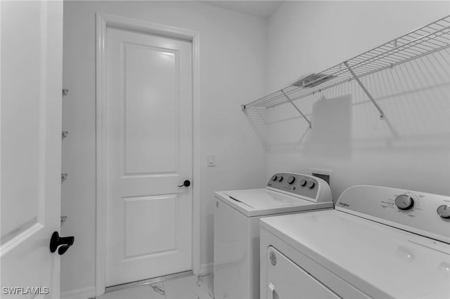 laundry room with independent washer and dryer