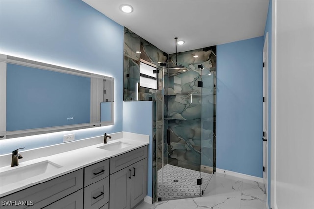 bathroom with a shower with door and vanity